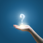 Hand holding a questionmark